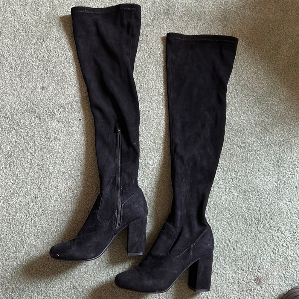 Knee high black heeled boots